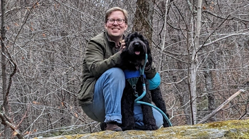 Erik and Ollie Erik and his Labradoodle Ollie, the Spinning Dog of Saxonhollow, enjoy a crisp, autumn day at the top of Smuggler's Notch.